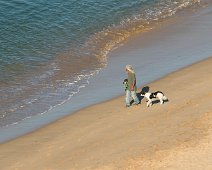 Man met hond Strand, Portugal